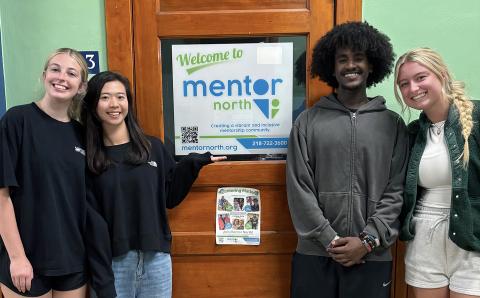 a graduate student with undergraduate research assistants