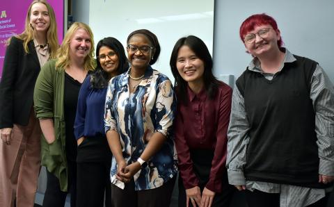 a group of graduate students with a professor